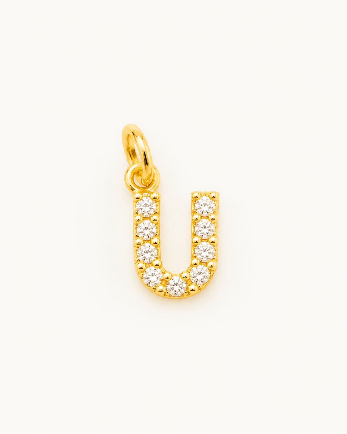 Charm letra U circonitas Gold BEOCCA